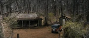 The front of the Allen Cabin, along with the nearby tool shed ()
