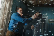 Ash and Baal fist-fight in one of the cabin's bedrooms.