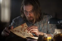 Lou-taylor-pucci.jpg (42 KB) Eric unwraps the object and discovers that it’s a book with a cover made of human skin stitched together.