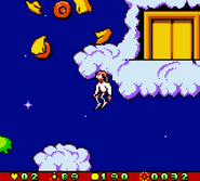 Jim jumping for joy after blowing up a smiley face.