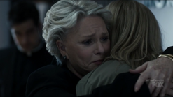 Angela hugs her mother in relief.