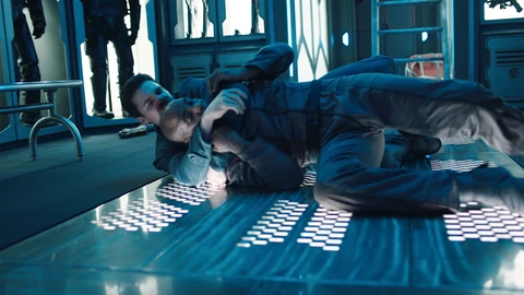 Holden wrestles with Ensign Ranhofer