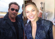 Rousey on the set of the third film with Arnold Schwarzenegger