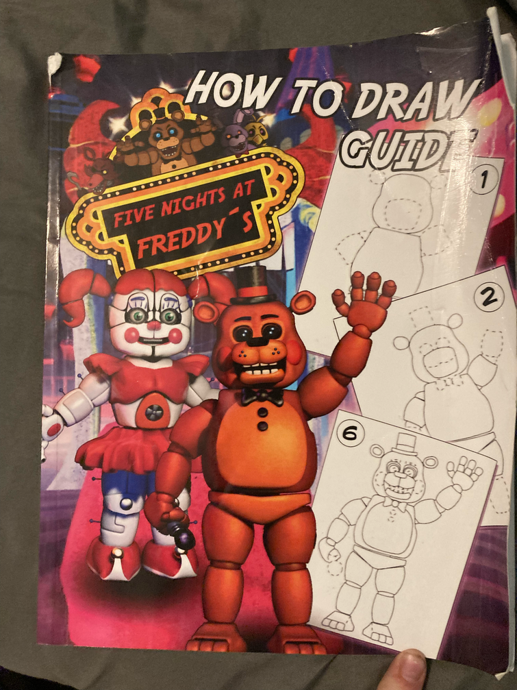 This is a fnaf drawing book I have and it has Sparky the dog in it Fandom