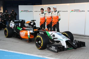 The team unveiling the VJM07