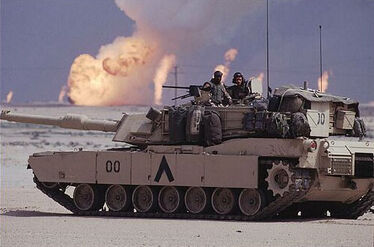 An M1A1-ODS of the 5th Armored Division passing by the burning oil fields in Kuristan.