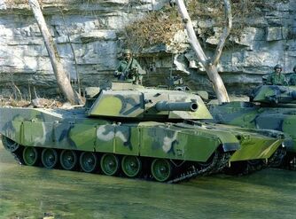 An M1-IP of the 2nd Cavalry Division with Tropical Multipurpose Vehicle Camouflage Pattern (MVCP)