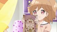 Kano holding a Picturebook of Fairilu