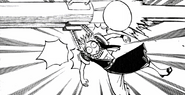 Natsu hanging off a missile