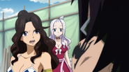 Mirajane listening to Gajeel's plan