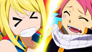 Natsu steps on Lucy while dancing