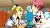 778px-Lucy treating Natsu and Happy to dinner