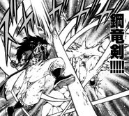 Gajeel cuts Torafuzar down with Steel Dragon's Sword