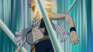 Natsu striked by Zalty's ball