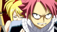 Lucy preventing Natsu from causing a ruckus