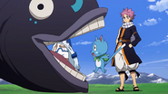 Natsu watching Happy getting eaten