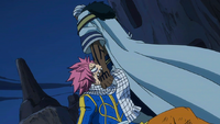 Natsu bites Brain as he drags him