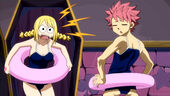 Lucy and Natsu in matching swimsuits