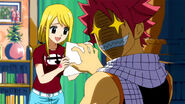 Natsu shows Lucy a request