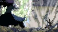 Natsu deflects Gajeel's breath attack