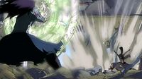 Natsu deflects Gajeel's breath attack