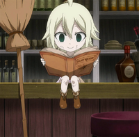 Young Mavis reading a book