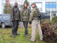 Everton, Christina, and Edwin in front of the hospital.