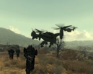 Three Enclave soldiers wearing the armor being dropped off from a Vertibird