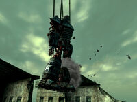 Liberty Prime being hoisted into battle by a crane