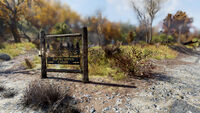 Alpine River Cabins sign