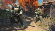 A pair of Army troopers wearing T-60 power armor in olive drab