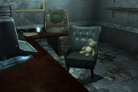 Teddy bear sitting on a chair