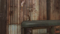 Mini totem pole on top of a tinker's workbench