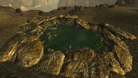 Bigger radioactive bomb crater, filled with water