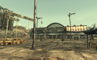 A corpse hung from a lamppost outside Super-Duper Mart