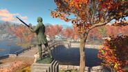 Minuteman statue on a plinth at the entrance of Sanctuary Hills