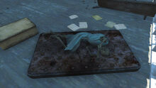 Holotape in the suitcase to the left