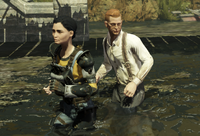 Sloane and Vin wading through the waters