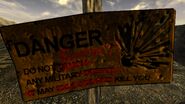 Danger! Do not enter. Any military may kill you warning sign
