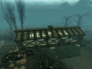 An image of the "HELP US" message on the roof.