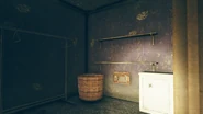 FO76SD Orwell Orchards bomb shelter bedroom safe.png (2.41 MB) Bedroom with a locked safe (Picklock 2) beside a hamper