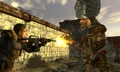 Pre-release screenshot of Tabitha fighting the Courier, using the old body type (recolored Fallout 3 mutants)
