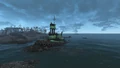 A beached tugboat on the shore