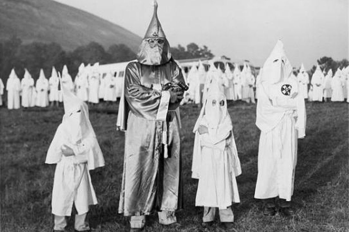 Three teenagers in Texas dressed in KKK garb for Halloween before