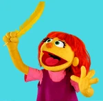Julia's puppet form holding feather