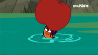 Sierra carries an apple using her head.