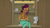 Sierra using her phone in the confessional.