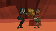 Courtney is offered flowers by Gwen...