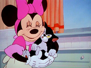Minnie with Figaro in cartoon shorts