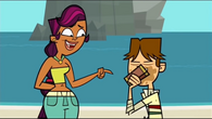Sierra talks to Cody while he eats candy.